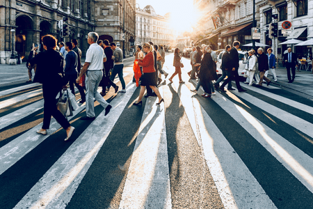 Image of people walking a crosswalk